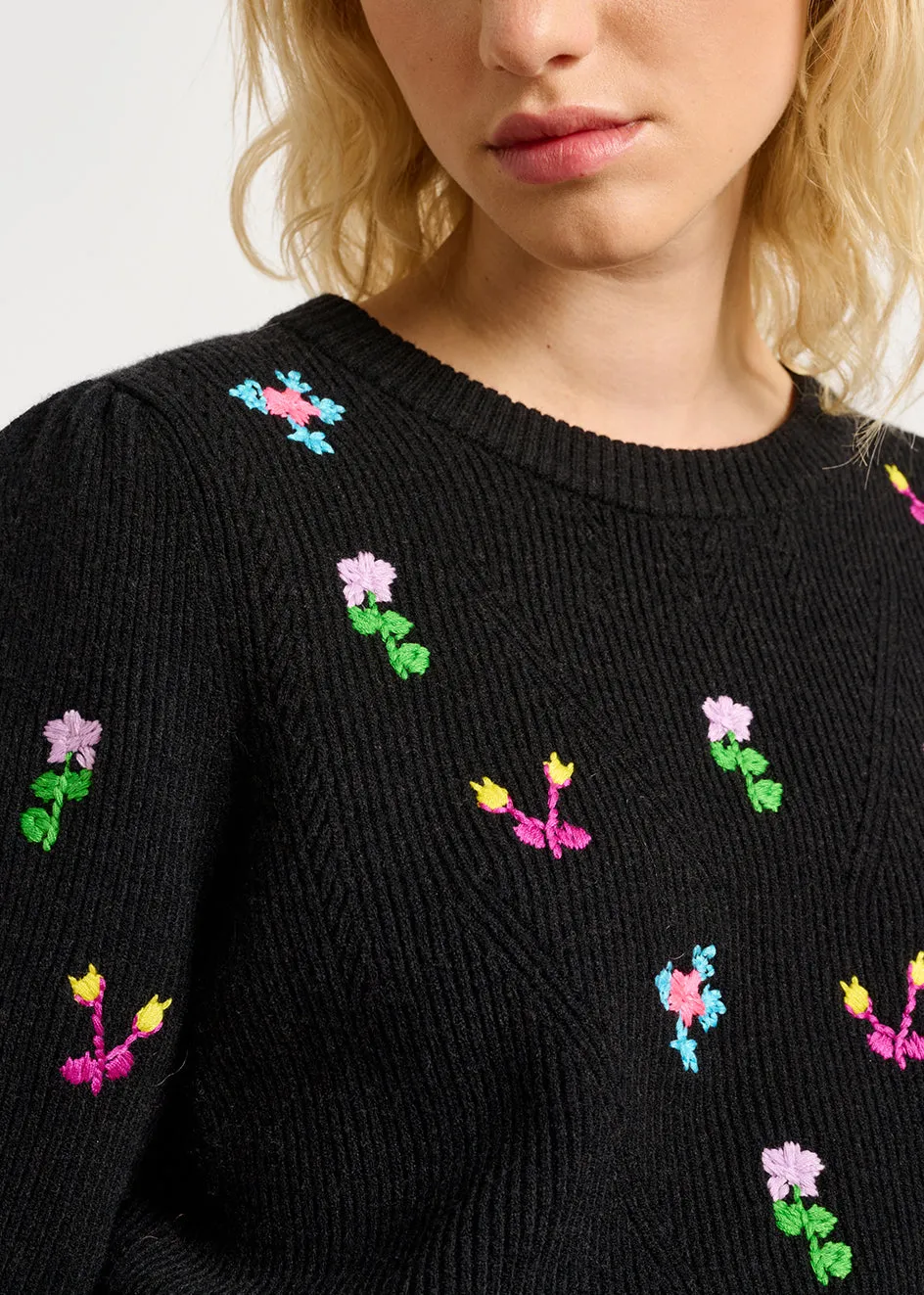 Black pointelle-knitted sweater with floral embroideries