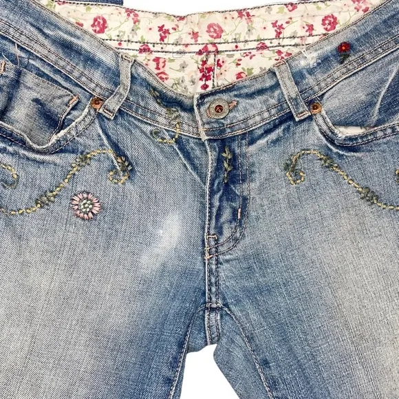 Ralph Lauren floral embroidered bootcut distressed bootcut jeans.