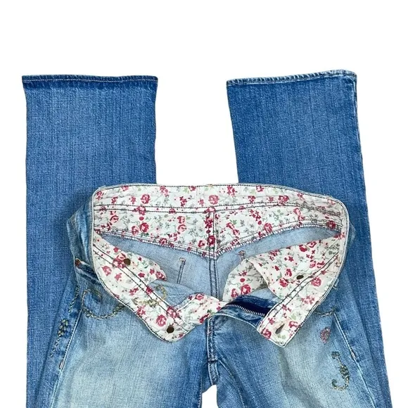 Ralph Lauren floral embroidered bootcut distressed bootcut jeans.