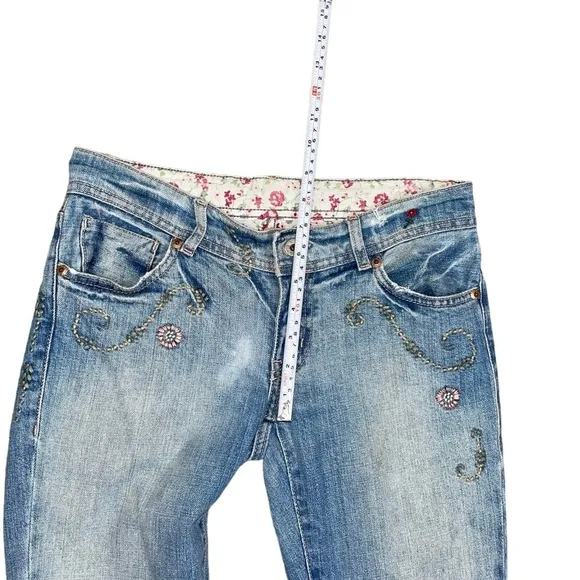 Ralph Lauren floral embroidered bootcut distressed bootcut jeans.