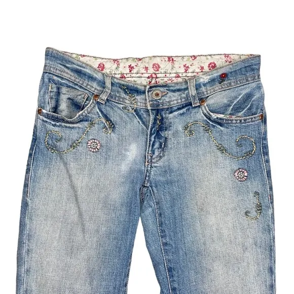 Ralph Lauren floral embroidered bootcut distressed bootcut jeans.