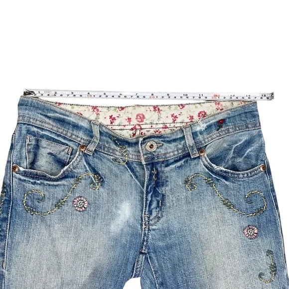 Ralph Lauren floral embroidered bootcut distressed bootcut jeans.
