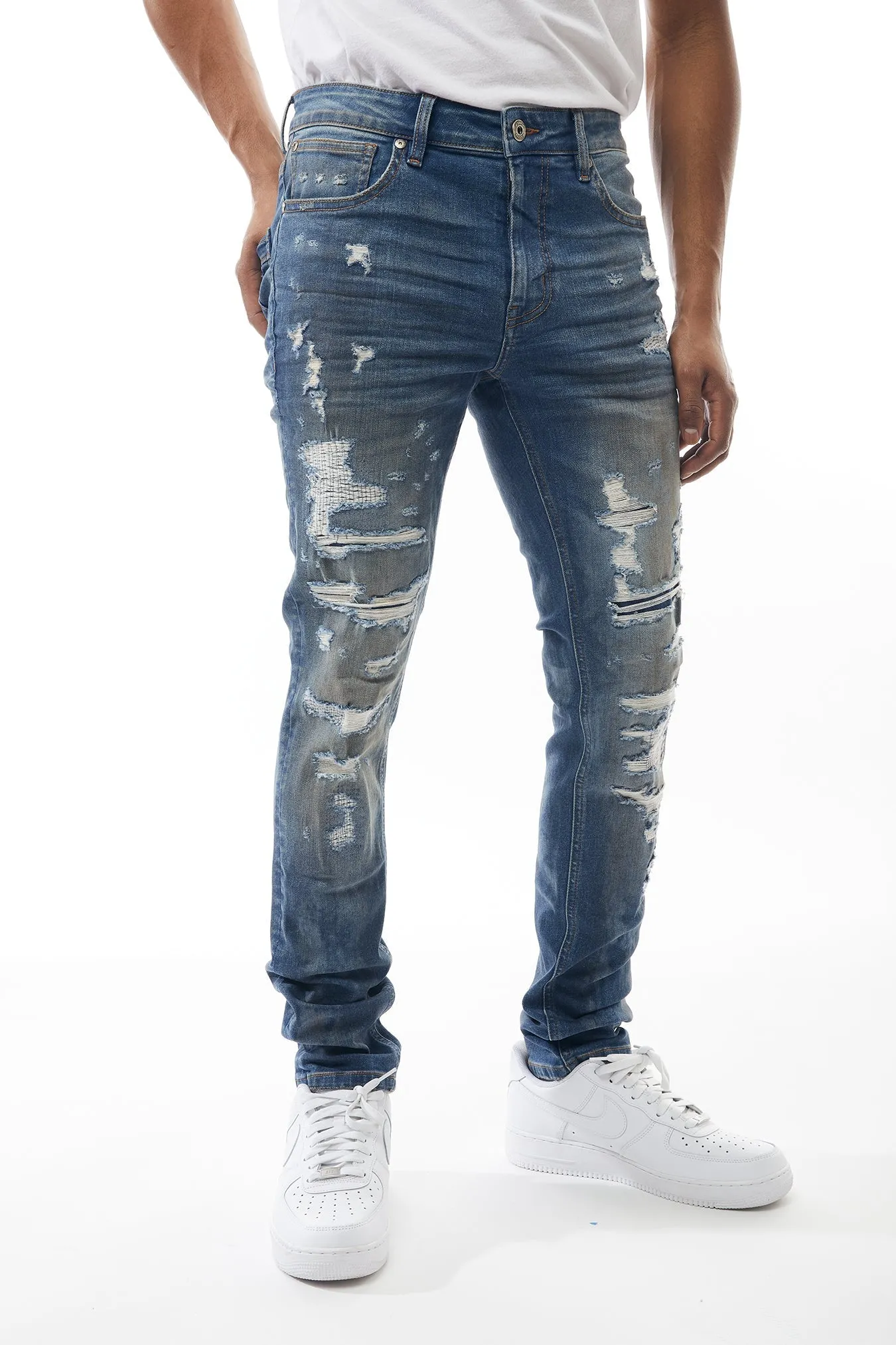 Ripped and Repaired Denim Jeans in Cobalt
