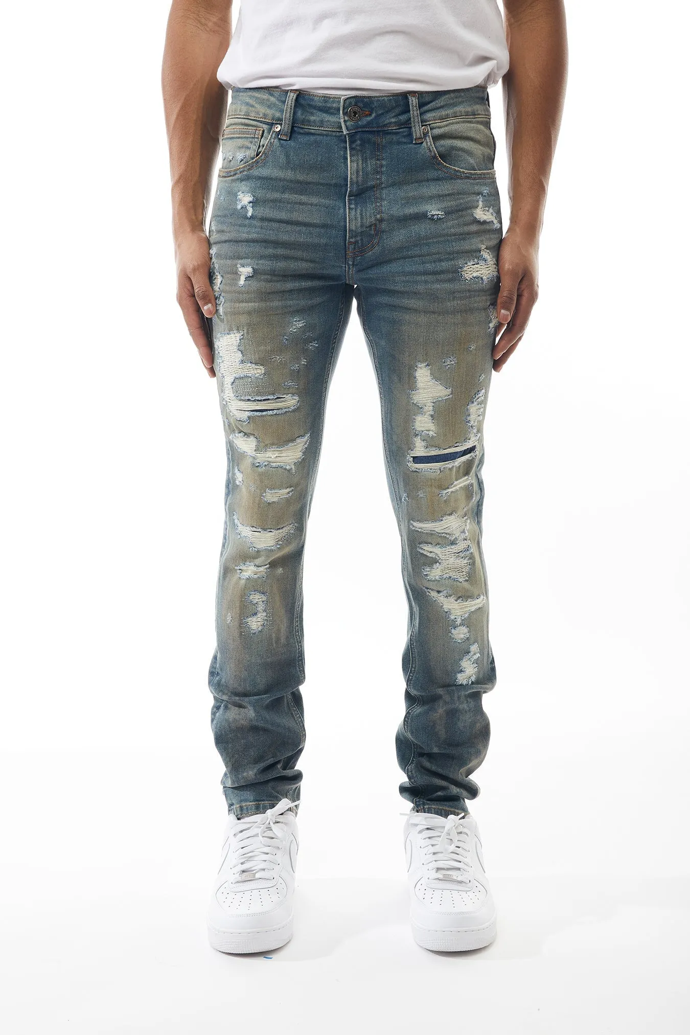 Ripped and Repaired Denim Jeans in Cobalt