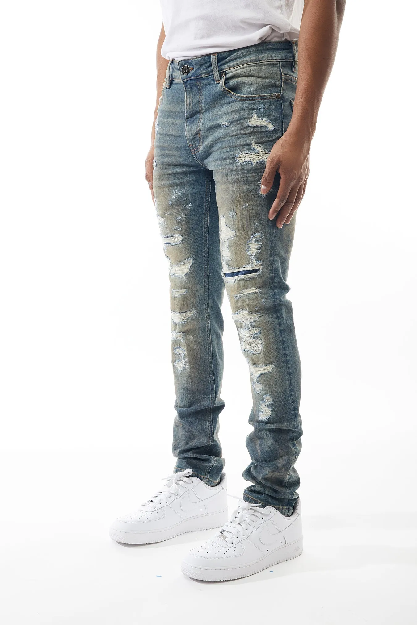 Ripped and Repaired Denim Jeans in Cobalt